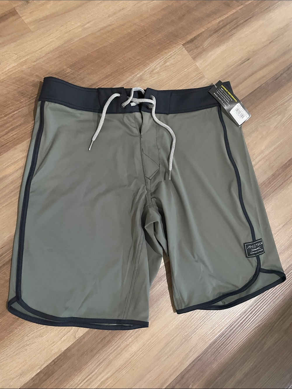 Men's Olive Green Board Shorts with Black Trim (size 30)